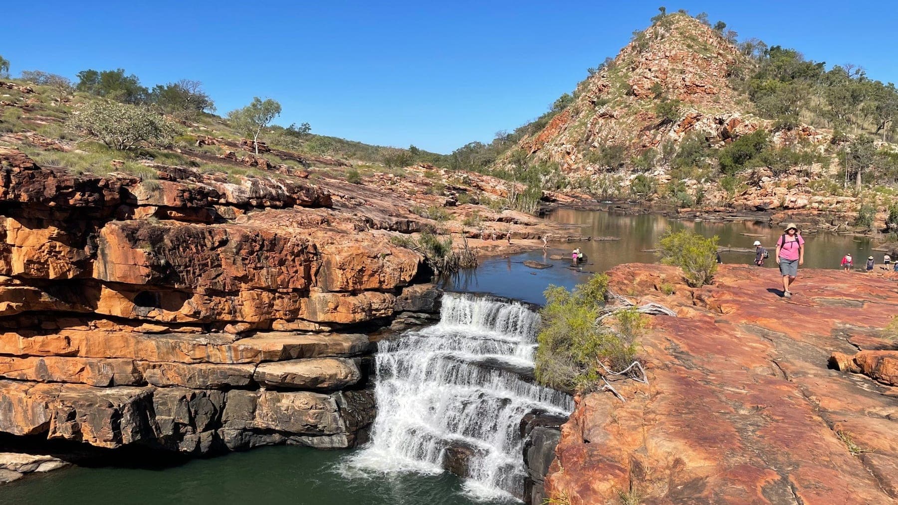 Bell Gorge waterfall cascading into the deep pool below