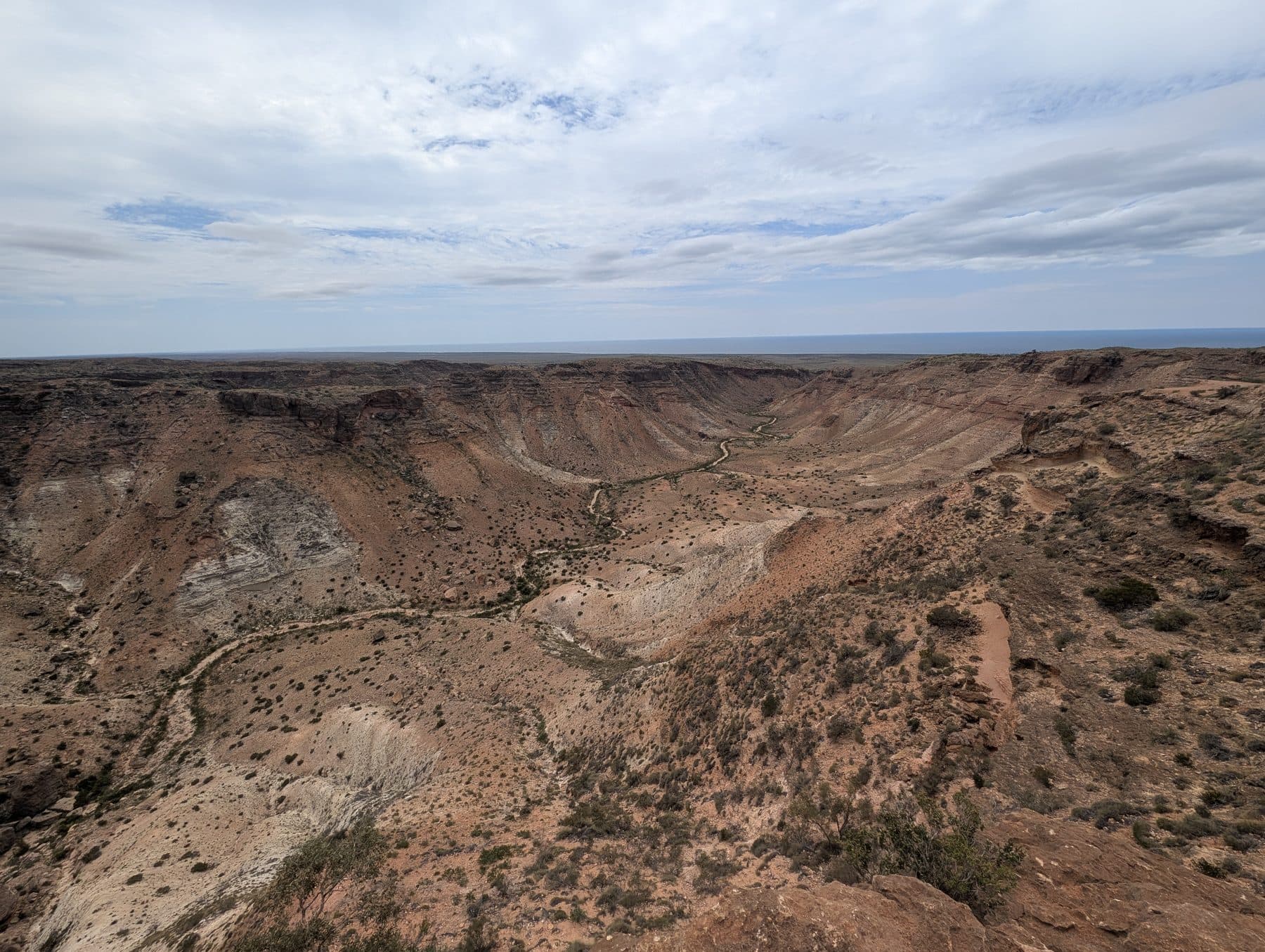 A deep red canyon in the Cape Range winding down towards the ocean near Exmouth
